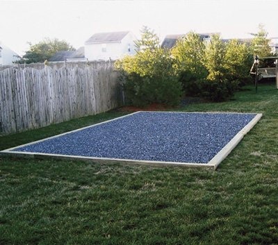 Timber framed gravel shed base laid level on a lawn